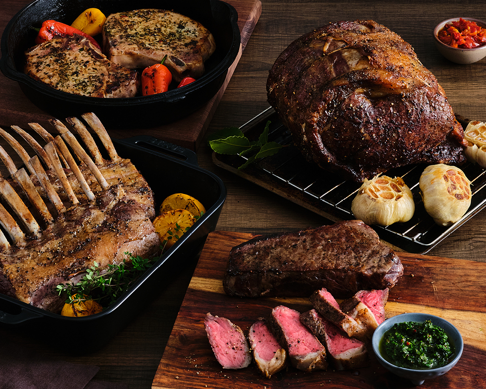 An assortment of cooked meats, sauces, and produce