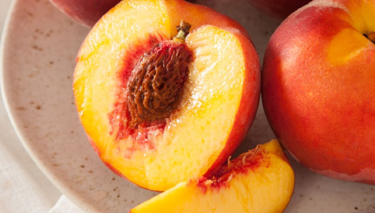 Sliced Juicy peach on a plate