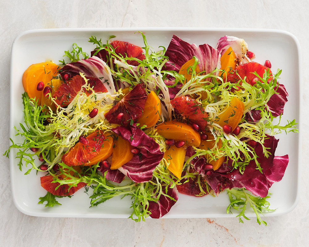 Winter wellness salad on rectangular white plate