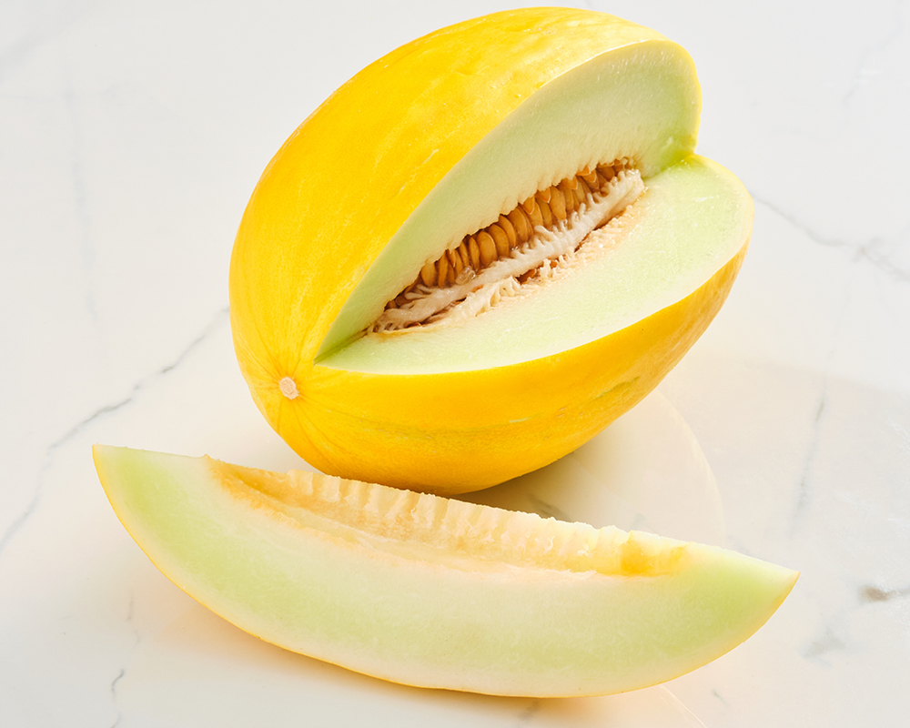 Canary melon with cut wedge