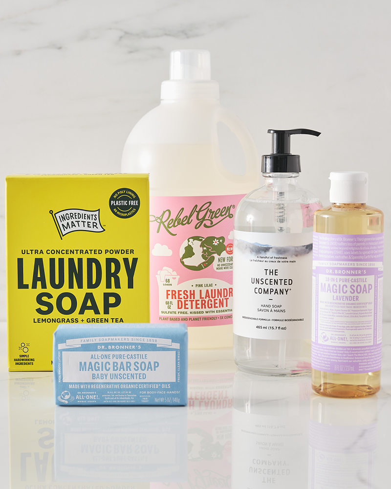 Cleaning products on shiny white marble background