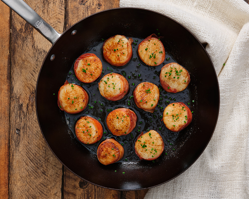 Made In carbon steel pan with prosciutto-wrapped scallops