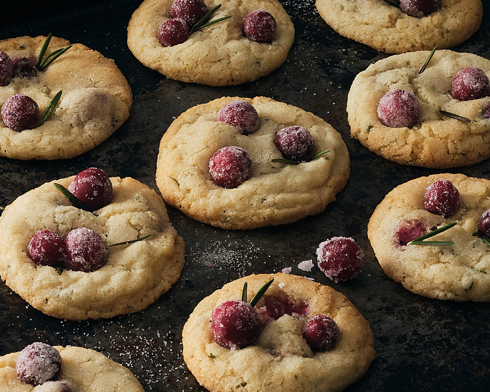 Snow Cranberry Rosemary Cookies on a slate serving platter
